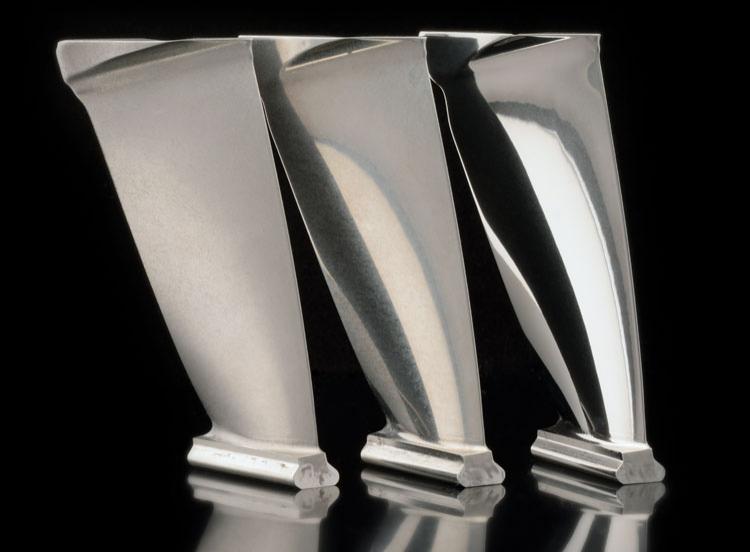 Precision surface finishing turbine blades.