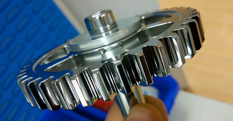 Superfinishing racing motorcycle parts.