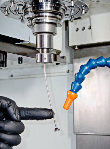 Orbitool - mounted in a machine to deburr holes